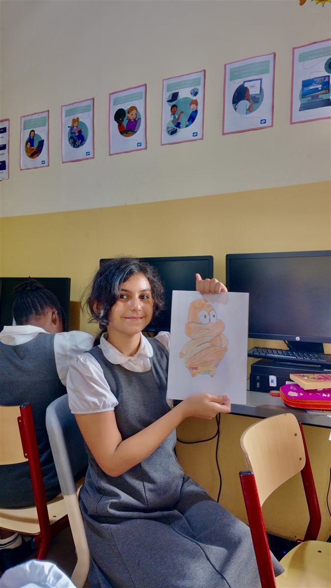 A Wild Card Club child proudly holding up her own drawing
