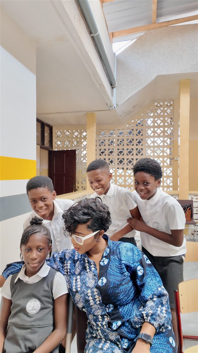 Veana Negasi talking with Wild Card Club children